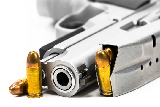 Bullets placed on the muzzle on a white background.