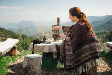 Fototapeta premium Female tourist having tea in the mountains of Turkey