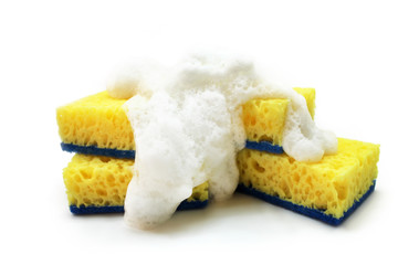 Yellow sponge for washing dishes with white foam isolated on white background. 
