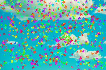metaphysical cloudy turquoise sky with white soft clouds and butterflies