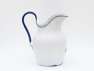 Rustic old enameled metal kettle