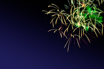 Colorful firework on the night sky. New Year celebration fireworks. Abstract firework isolated on black background with free space for text