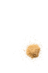 Heap of organic raw brown sugar isolated on white background. Vertical composition. Top view