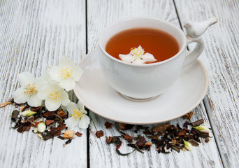 Cup of tea with jasmine flowers