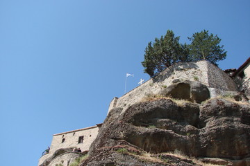 view of the wall of the Greek male monastery built on top of the rocks of St. Meteori.