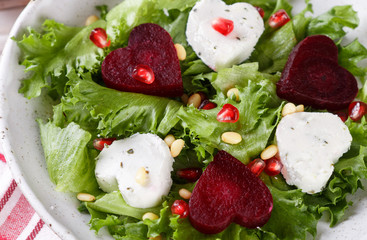 Fresh salad with goat cheese, roasted beets and lettuce