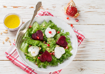 Fresh salad with goat cheese, roasted beets and lettuce