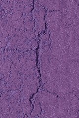 Purple Aged cement wall texture, cracked rock background, rough surface