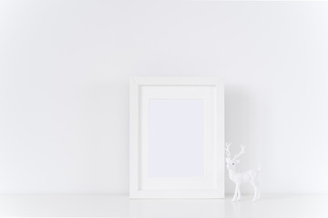 Naklejka na ściany i meble White frame with white fawn
