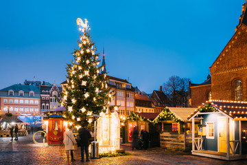 Fototapeta na wymiar Riga, Latvia. Christmas Market On Dome Square. Christmas Tree And Trading Houses