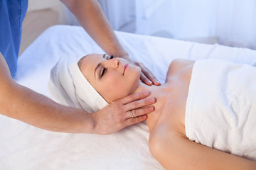 Fototapeta na wymiar girl masseur doing massage in spa health
