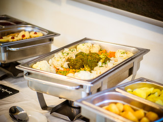 Warm buffet with Spanish paella and mixed buttered vegetables