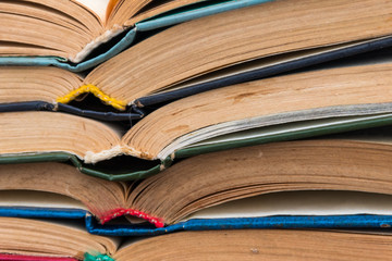 Stack of the old open books for background