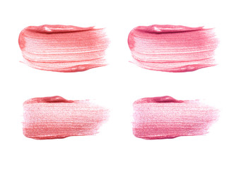 Set of different lip glosses smear isolated on white. Smudged makeup product sample