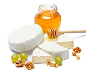 Round brie or camambert cheese and honey jam on a white background