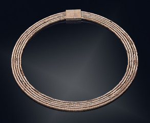 Golden necklace with isolated on black