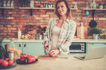 Cheerful woman on a modern kitchen