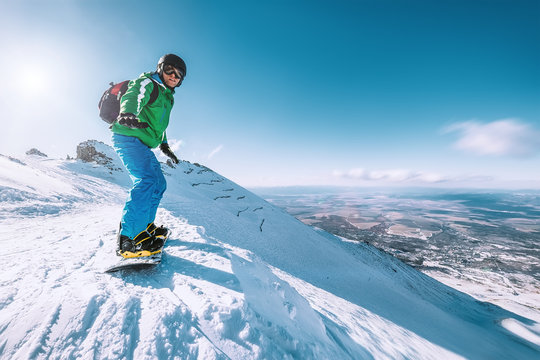 Snowboarder stay on the mountain top, Tatranska Lomnica, Slovakia