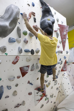 Indoor rock climbing man