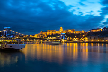 Illuminated building of Buda Castle and Chain bridge at night in  Budapest.