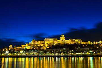 Illuminated building of Buda Castle and Chain bridge at night in  Budapest.
