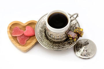 traditional turkish cup and wooden plate with heart candies for St. Valentine's Day and lukum