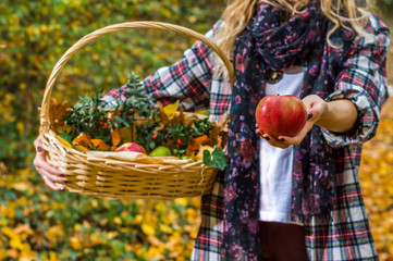 girl holding apple and the basket