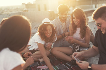 Playing cards on a building rooftop