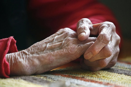 Close-up of wrinkled hands of senior man