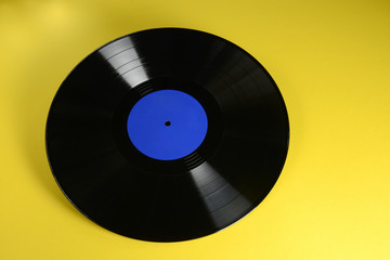 vinyl record on yellow background