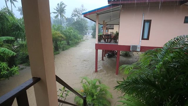 Flooding and tropical rain on the street in island Koh Phangan, Thailand