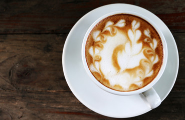Hot Latte coffee on the table in coffee shop Copy space