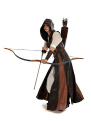 full length portrait of girl wearing brown  fantasy costume, holding a bow and arrow, on white...
