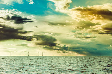 Obraz premium wind turbines power generator farm in sea