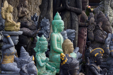 Sculptures of Hinduism gods in the art market of Ubud, Bali