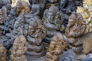Sculptures of Hinduism gods in the art market of Ubud, Bali