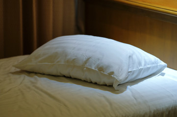 Fototapeta na wymiar pillow one alone on bed