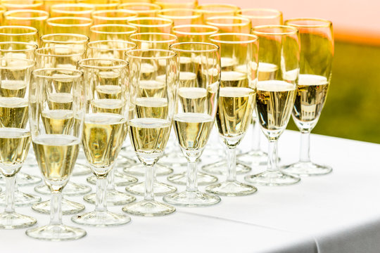 Many Glasses Of Champagne On White Table