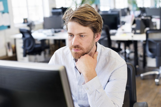 Man in office sitting at desk