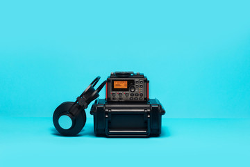 equipment for field audio recording on blue background. recorder, headphones and case. - 188539402