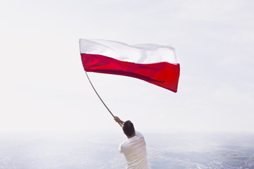 man with red and white flag