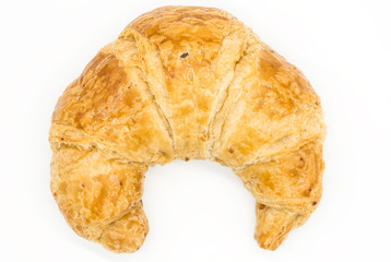 Fresh croissant isolated on a white background closeup .