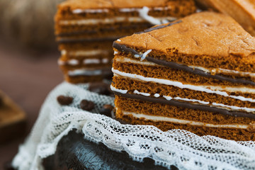 tender cake with coffee beans on a gray wooden background. Selective focus, close up. background...