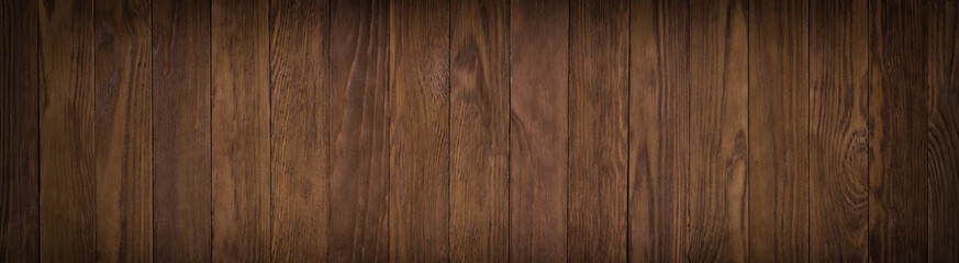 Dark wooden surface of a table 