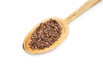 Wooden spoon with linseed or flax seed isolated on white background