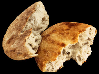 Freshly Fireplace Baked Domestic Traditional Aromatic Tender Leavened Pitta Flatbread Torn Loaf Halves Isolated On Black Background