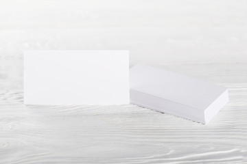 White Blank business card on wooden background. Place for ID