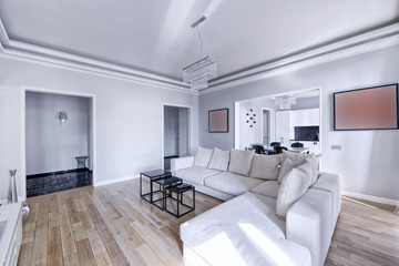 The interior of the spacious apartment in white tones.