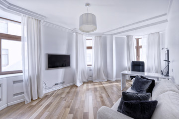 The interior of the spacious apartment in white tones.