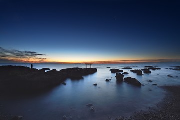 Fototapeta premium trii - gateway of shrine in the sea in the early morning by long exposure